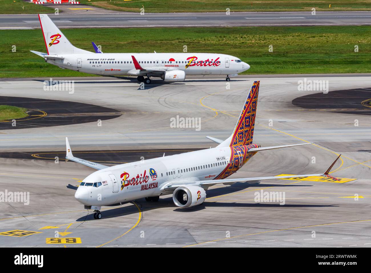Changi, Singapore - February 3, 2023: Batik Air Boeing 737 airplanes at Changi Airport in Singapore. Stock Photo