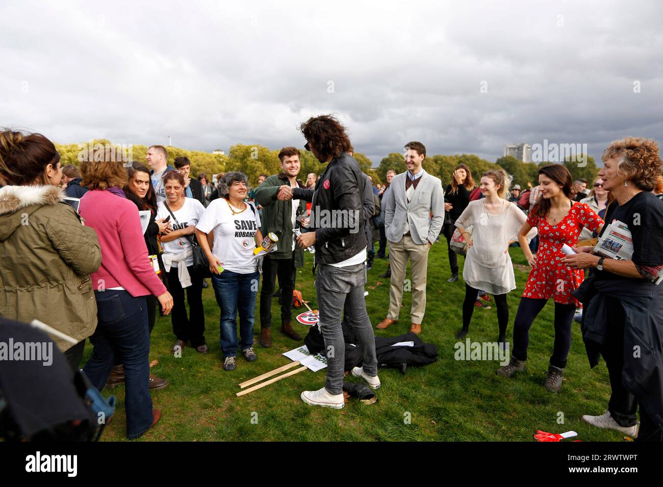 Russell Brand stands amongst the crowd listening to speeches at the TUC Rally 'Britain needs a pay rise' in Hyde Park, in London on 18 October, 2014. Stock Photo
