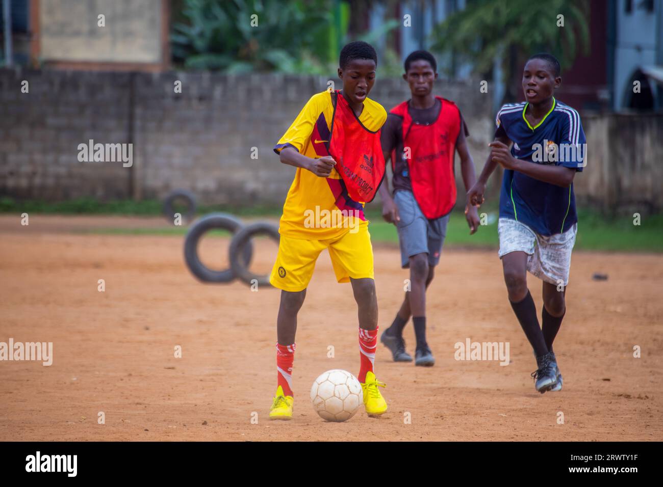 LAGOS, NIGERIA - SEPTEMBER 15: School boys playing soccer at Ansarudeen ...