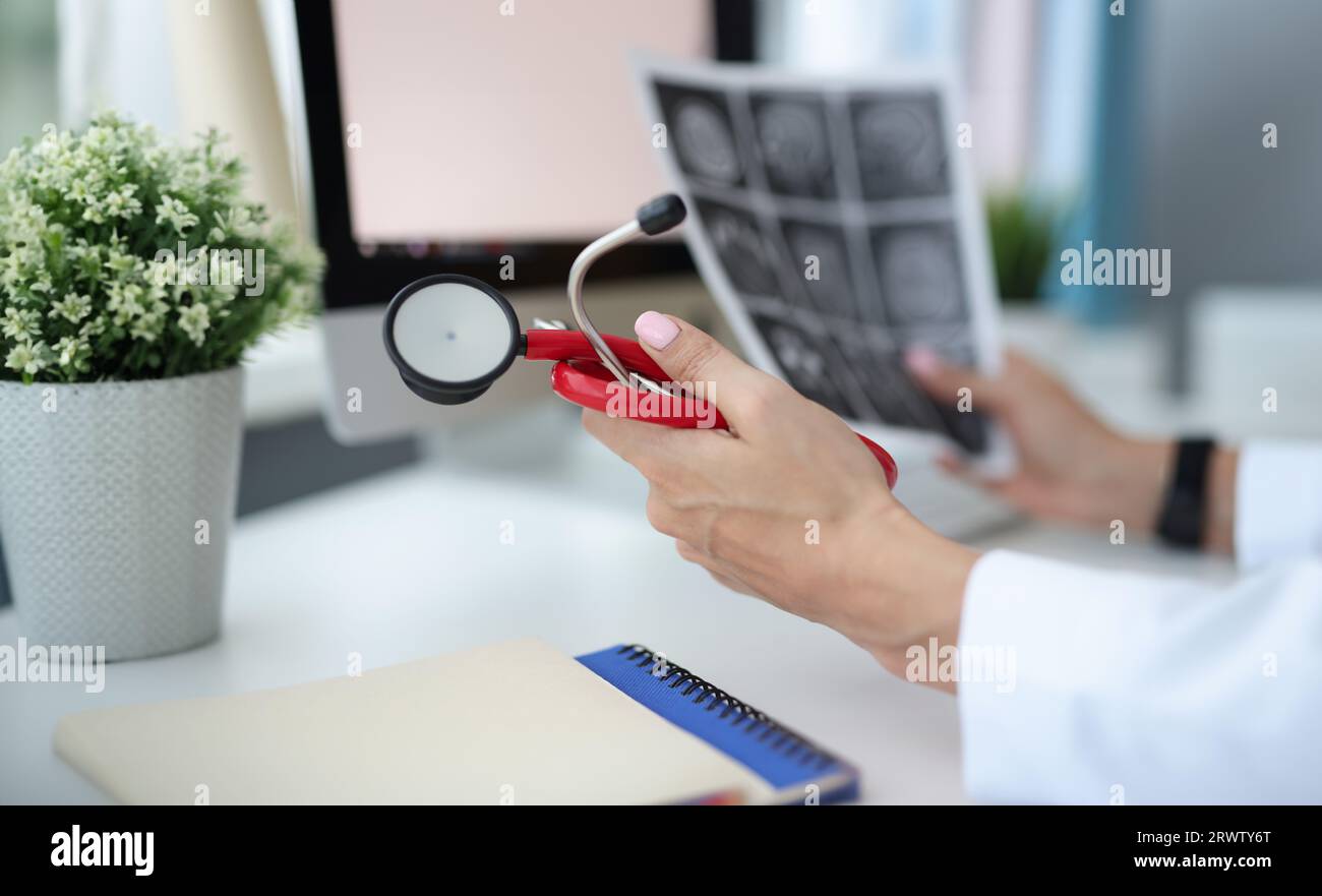 Doctor's hands are holding stethoscope and pictures of brain Stock ...