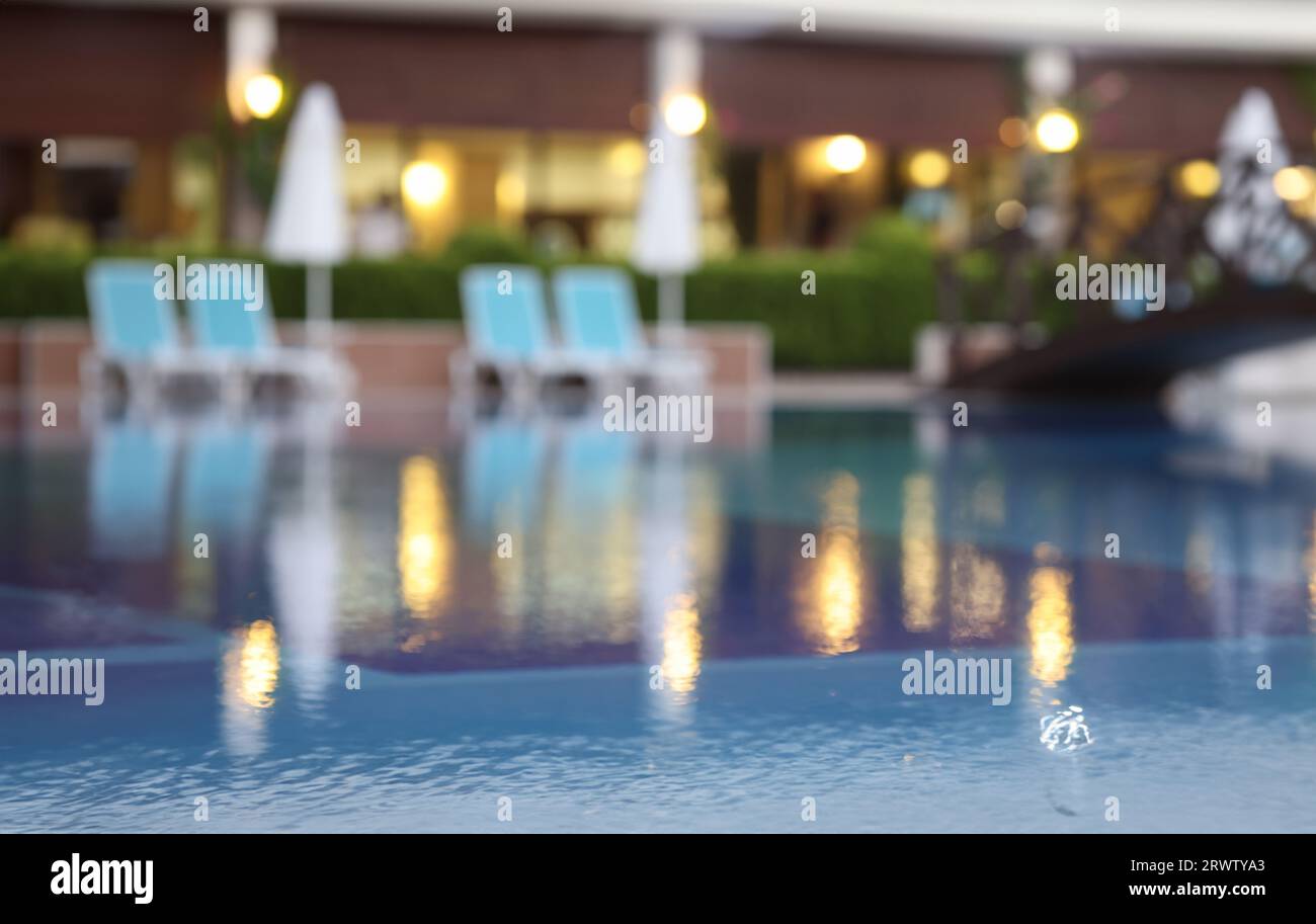 Evening blurred background of resort hotel and pool Stock Photo