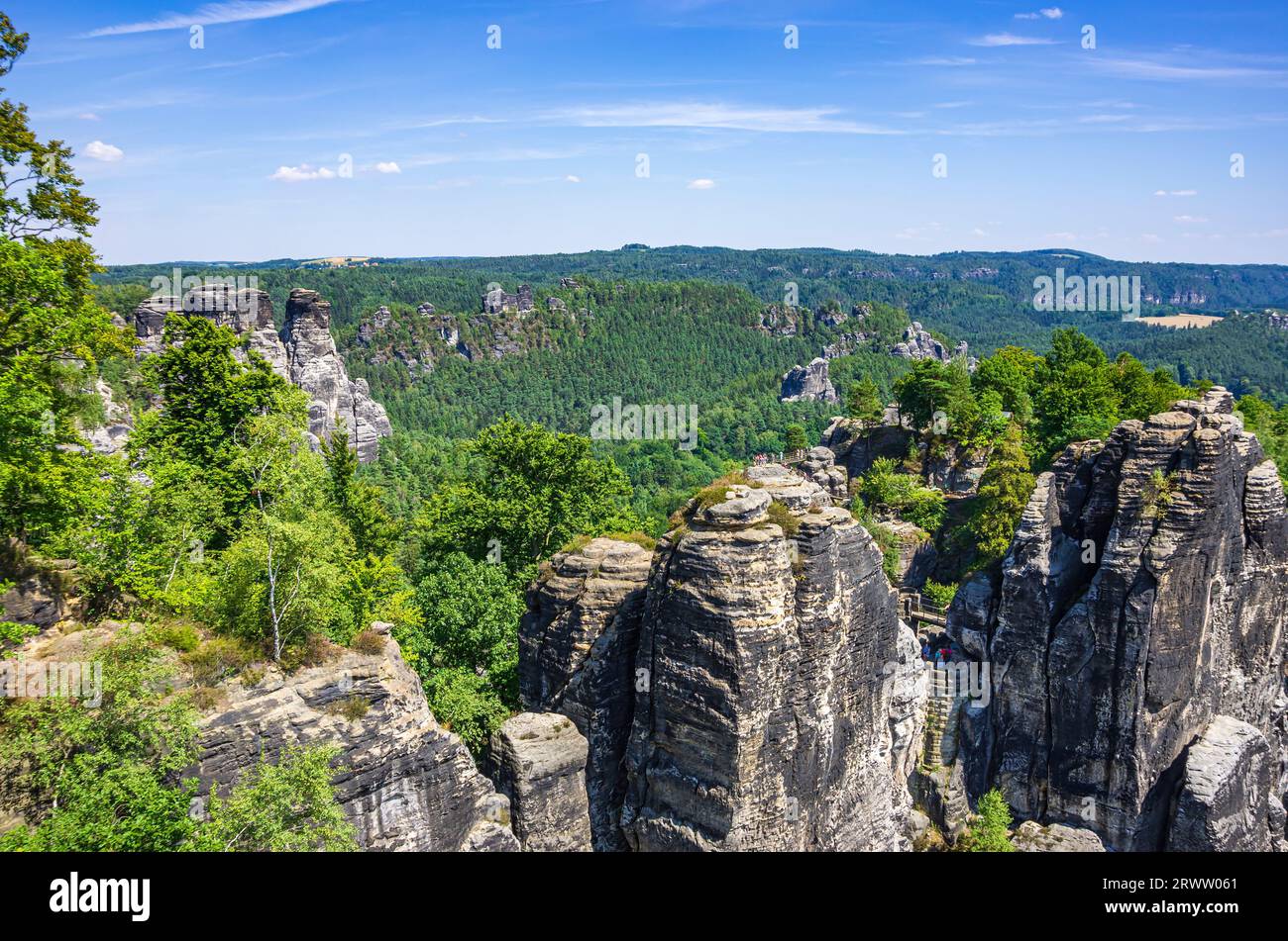 Picturesque view from the Bastei rock formation of the surrounding cliffs of the Elbe Sandstone Mountains, Saxon Switzerland, Saxony, Germany. Stock Photo