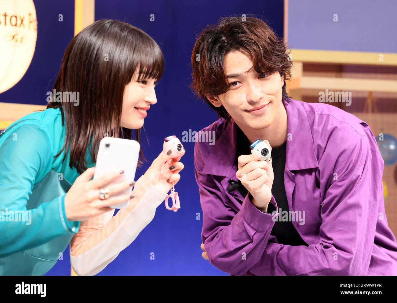 Tokyo, Japan. 21st Sep, 2023. Japanese actor Ryusei Yokohama (R) and actress Suzu Hirose (L) attend a promotional event of Fujifilm's new tiny digital camera 'Instax Pal' which enables to connect with smart phone or instant photo printer in Tokyo on Thursday, September 21, 2023. The Instax Pal which has a wide angle lens equibalent to 16mm in 35mm camera will go on sale on October 5. (photo by Yoshio Tsunoda/AFLO) Stock Photo