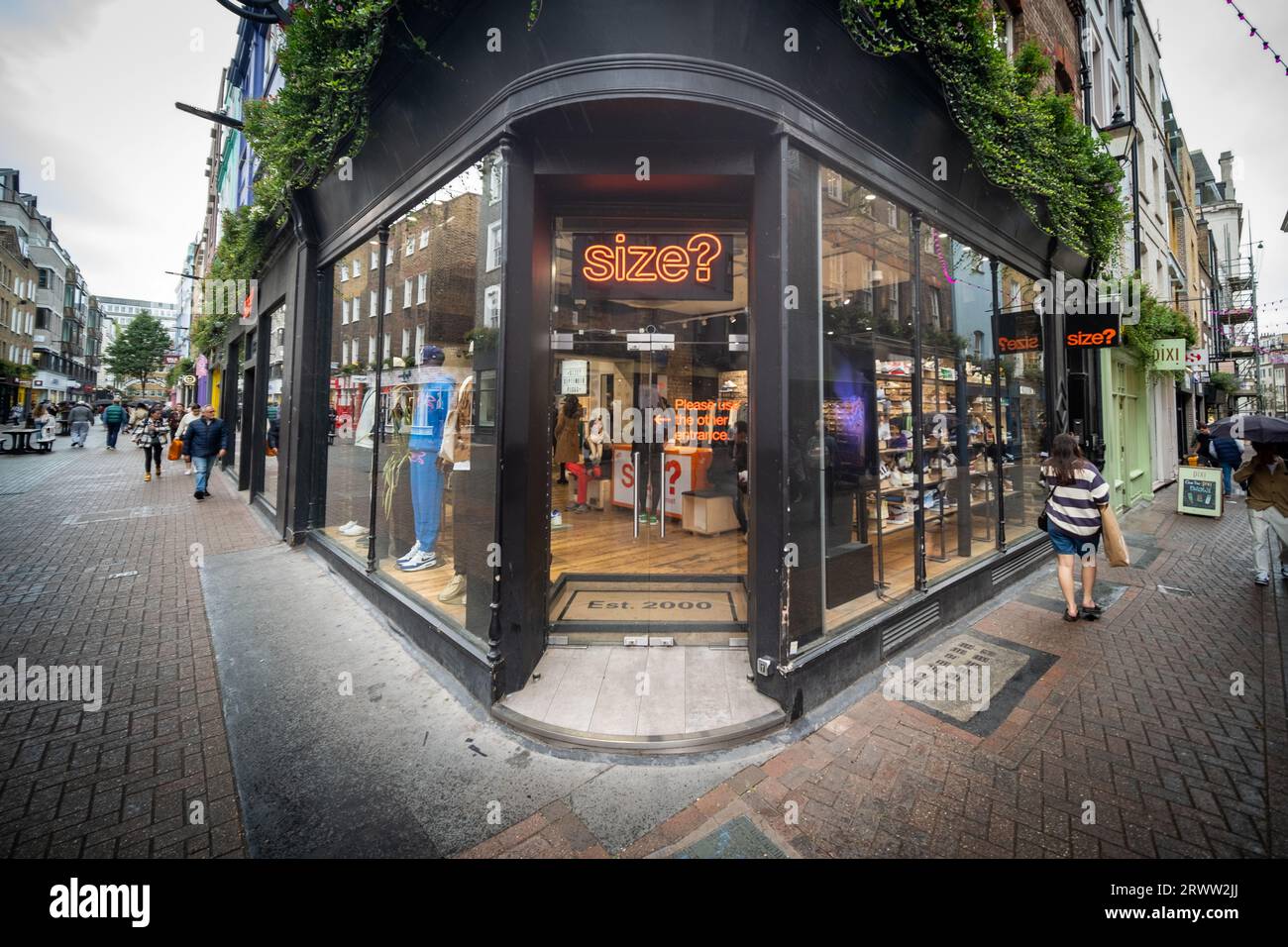 LONDON- SEPTEMBER, 19, 2023: Size? Shoe shop on Carnaby Street, a landmark fashion retail destination Stock Photo