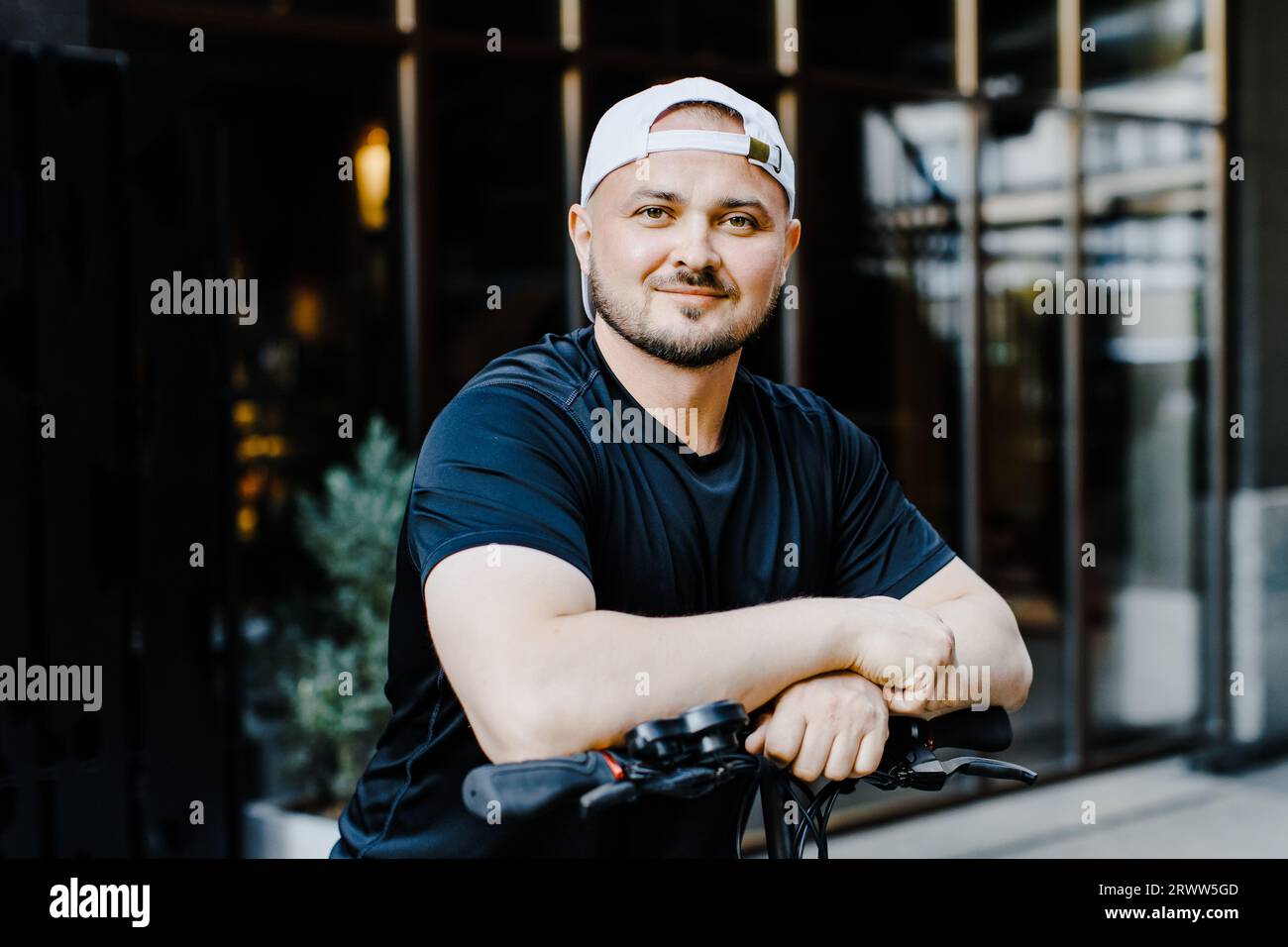 Happy man riding a scooter hi-res stock photography and images - Alamy