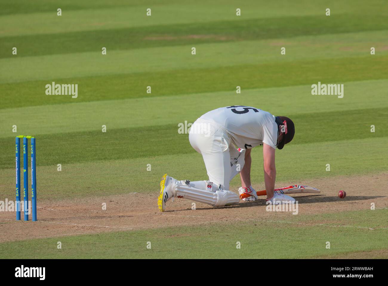 London, UK. 21st Sep, 2023. Surrey's Dom Sibley goes down after another blow to the box from Jack White as Surrey take on Northamptonshire in the County Championship at the Kia Oval, day three. Credit: David Rowe/Alamy Live News Stock Photo