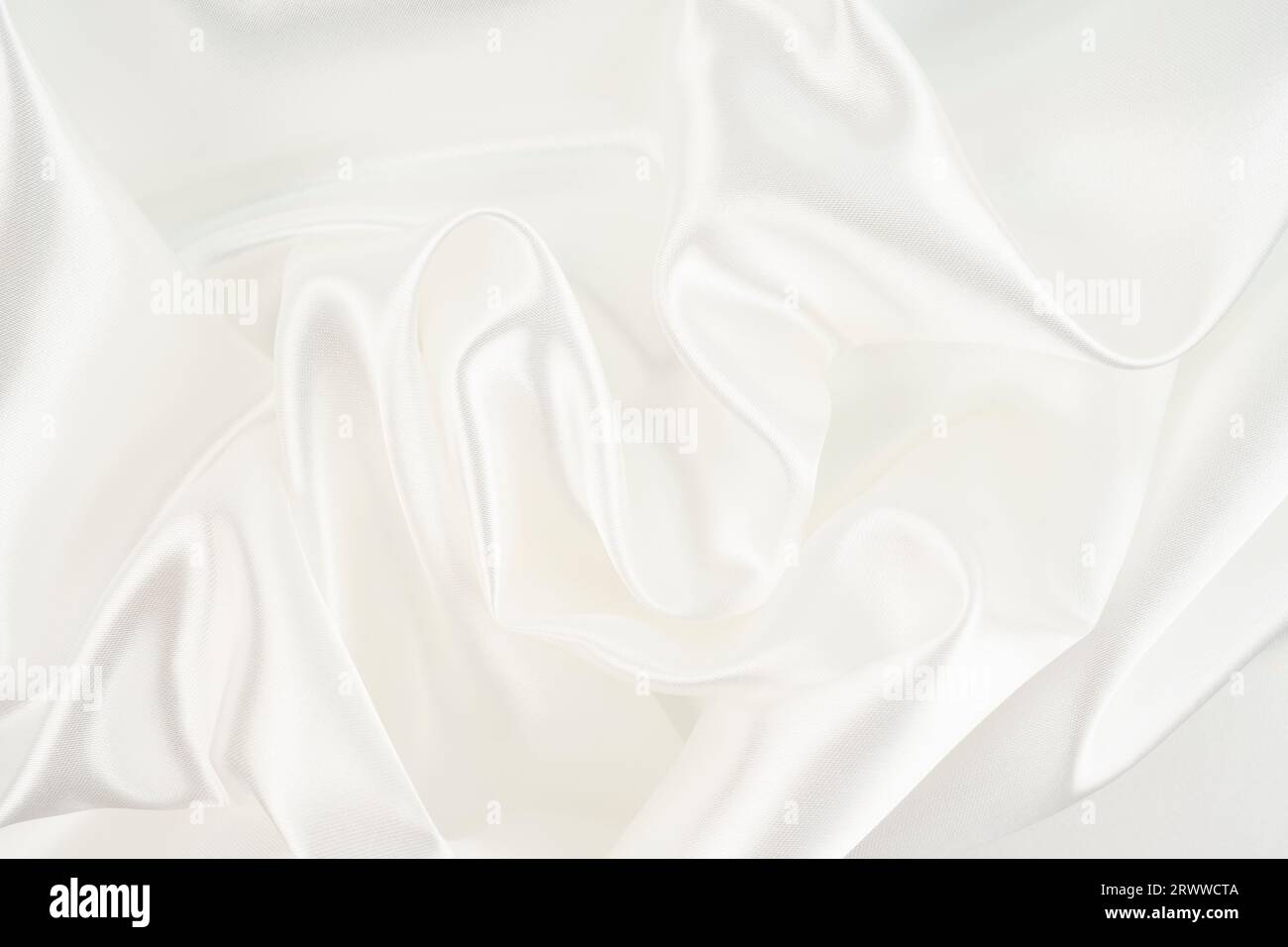 Closeup of rippled white silk fabric lines Stock Photo