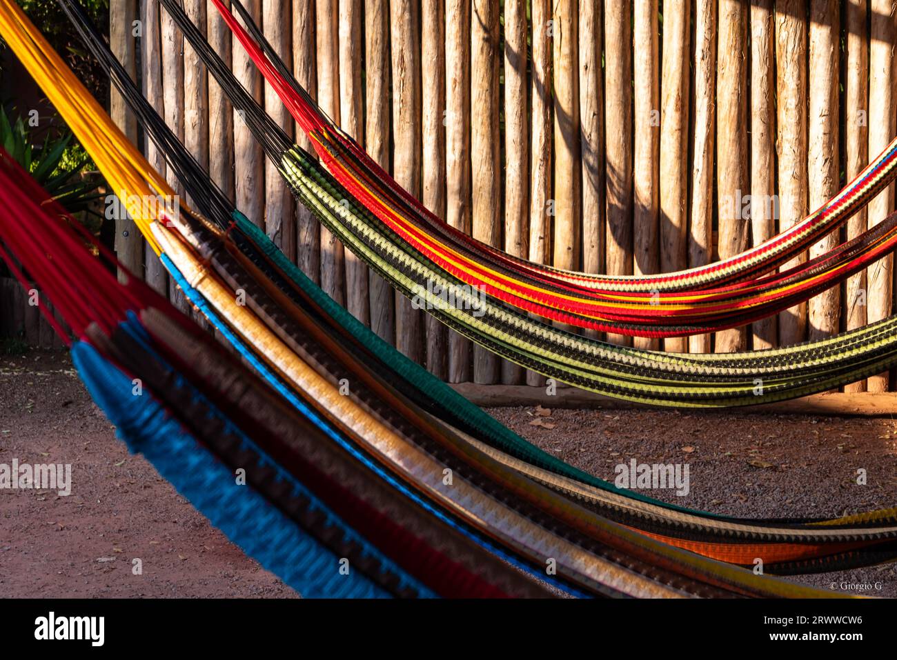 Detail of hammocks hanging under rustic indigenous hut in Brazil Stock Photo