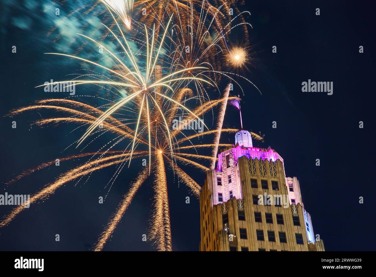 Gold fireworks behind Lincoln Tower downtown Fort Wayne on 4th of July