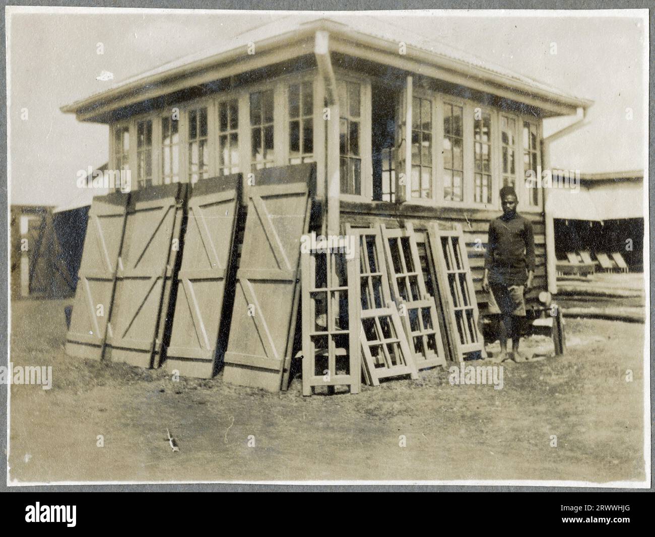 A Public Works Dept. apprentice stands next to a glass fronted ...