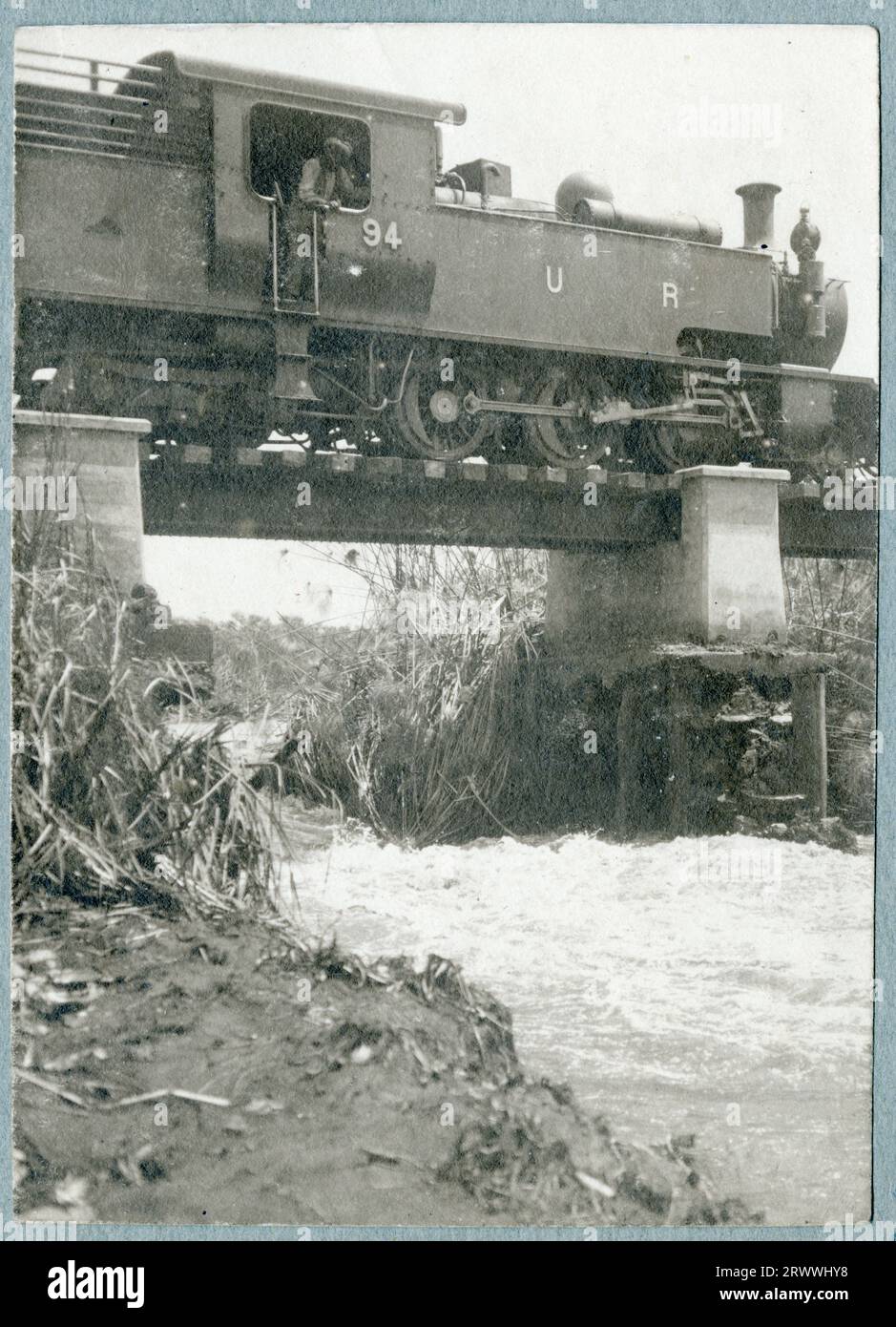 Uganda Railway train being driven over a bridge in the aftermath of a ...