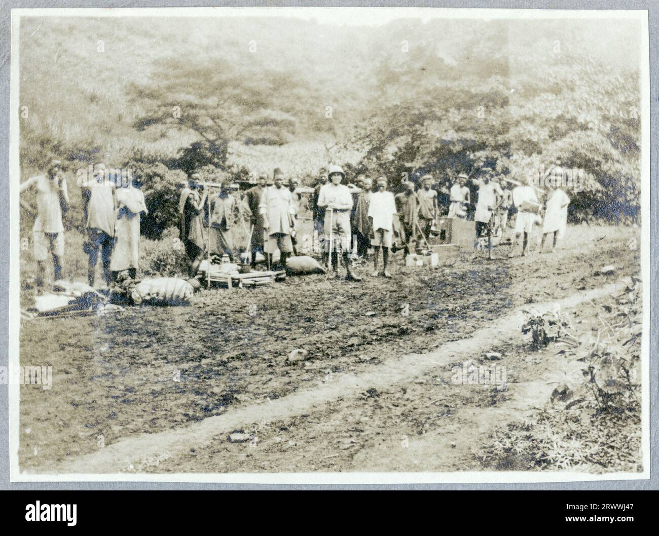 Mrs Bungey standing on the side of a Uganda Railway carriage. Part of a series of five prints entitled 'Trip to Maseno near Kisumu 1916.''  Original manuscript caption: Taken at Kibos Station. Stock Photo