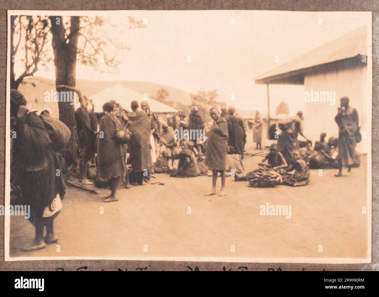 Adults and children from the Bungeys' party mill around on both banks of the Galana River. Original page caption: Picnic on the 'Galhana River' June 1927, Machakos. Stock Photo