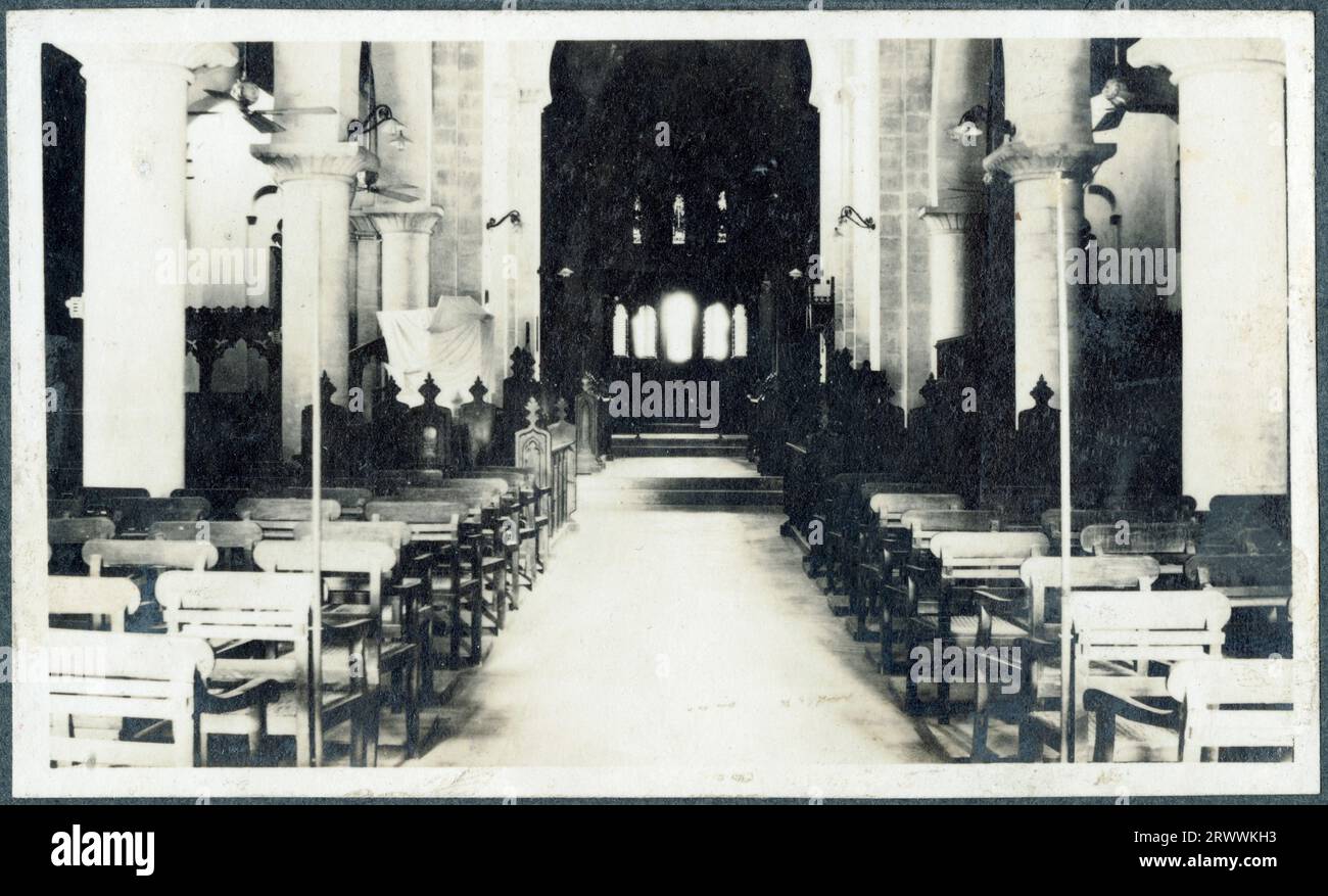 View of the nave of Mombasa Cathedral, looking towards the altar with seating visible either side of the aisle.  Original manuscript caption: '[Interior] Mombasa Cathedral'. Stock Photo