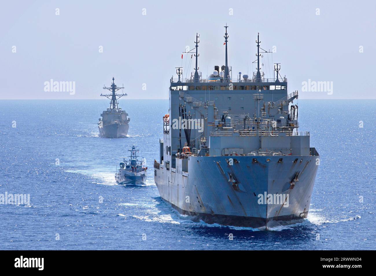 Pacific Ocean, United States. 16 September, 2023. The U.S Navy unmanned surface vessel USV Ranger, center, follows between the Lewis and Clark-class dry cargo and ammunition ship USNS Charles Drew, right, and the Arleigh Burke-class guided-missile destroyer USS Shoup, rear, during Integrated Battle Problem 23.2, September 16, 2023 on the Pacific Ocean. The Pacific Fleet exercise is to test, develop and evaluate the integration of unmanned platforms into fleet operations.  Credit: MC2 Jesse Monford/US Army/Alamy Live News Stock Photo