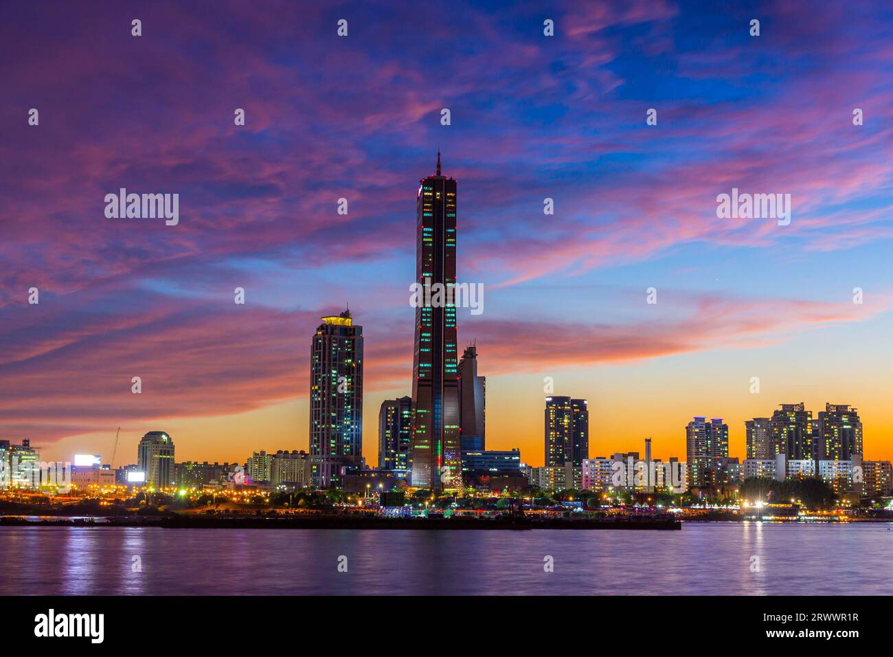 Seoul city Skyscrapers at night along the Hangang River after sunset at twilight and the sky with beautiful colors at yeouido, south Korea. Stock Photo