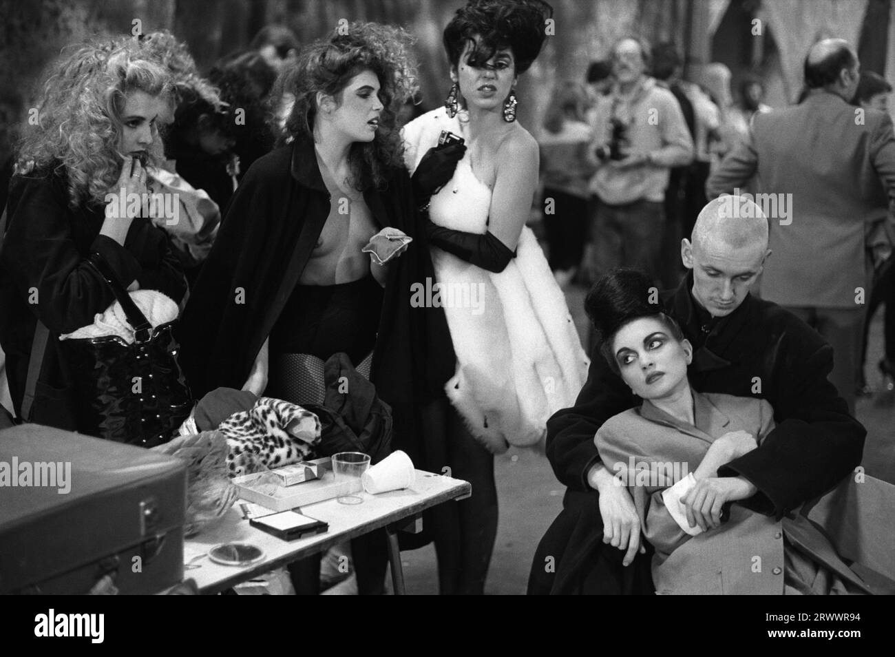 London 1980s UK. Luciana Martinez de la Rosa, known simply as Lulu. (centre-white fur,) who was co-host of at the Alternative Miss World Competition and Princess Julia (bottom right, with coat). The Alternative Miss World Competition was a pansexual beauty pageant competition and art and fashion event staged by artist Andrew Logan.  Grand Hall, Olympia, West London England 1981. 1980s UK HOMER SYKES Stock Photo