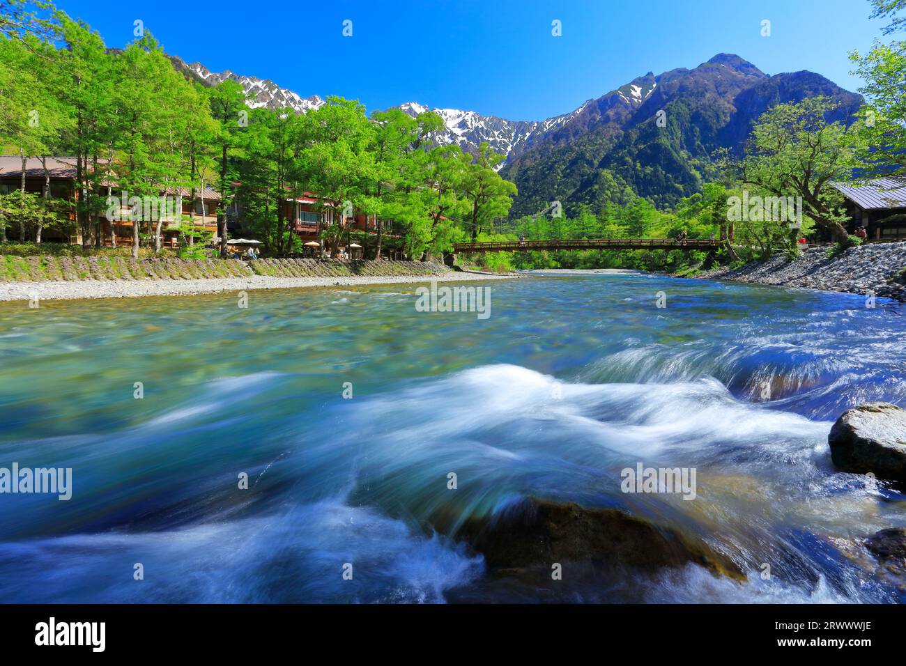 Kappa-bashi Bridge and lingering snow on the Hotaka mountain range in ...