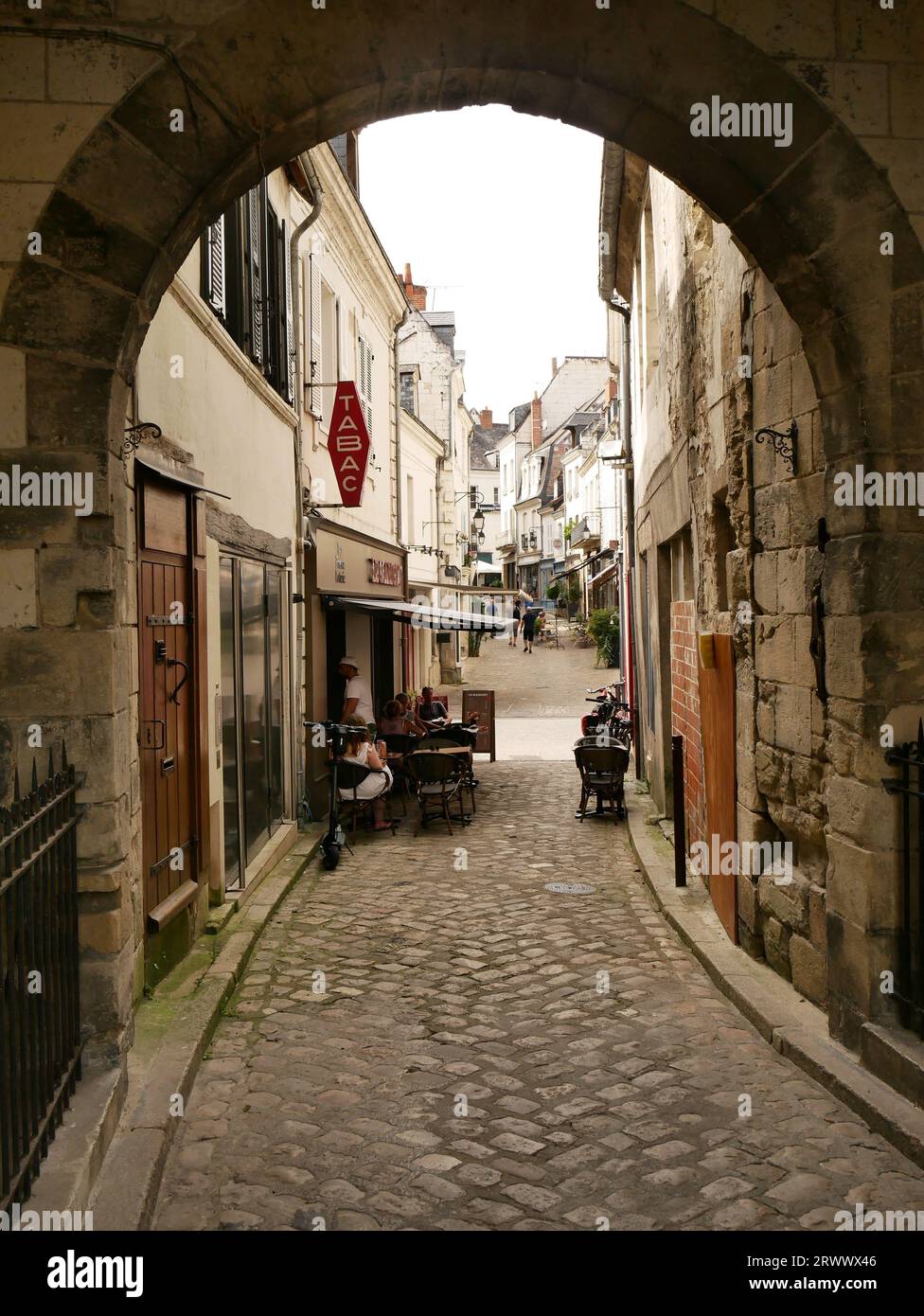 Tabac seen through medieval arch in the historic city of Loches,  Indre-et-Loire, France Stock Photo