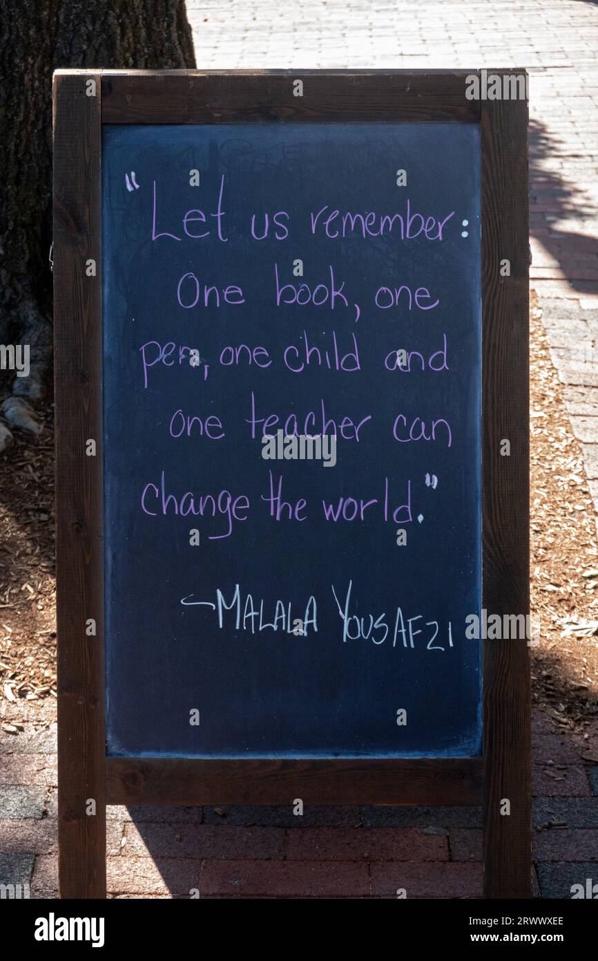A blackboard with a Malala Yousafzi quote about how one book, one child, one pen, one teacher can change the world. In New Canaan, Connecticut. Stock Photo