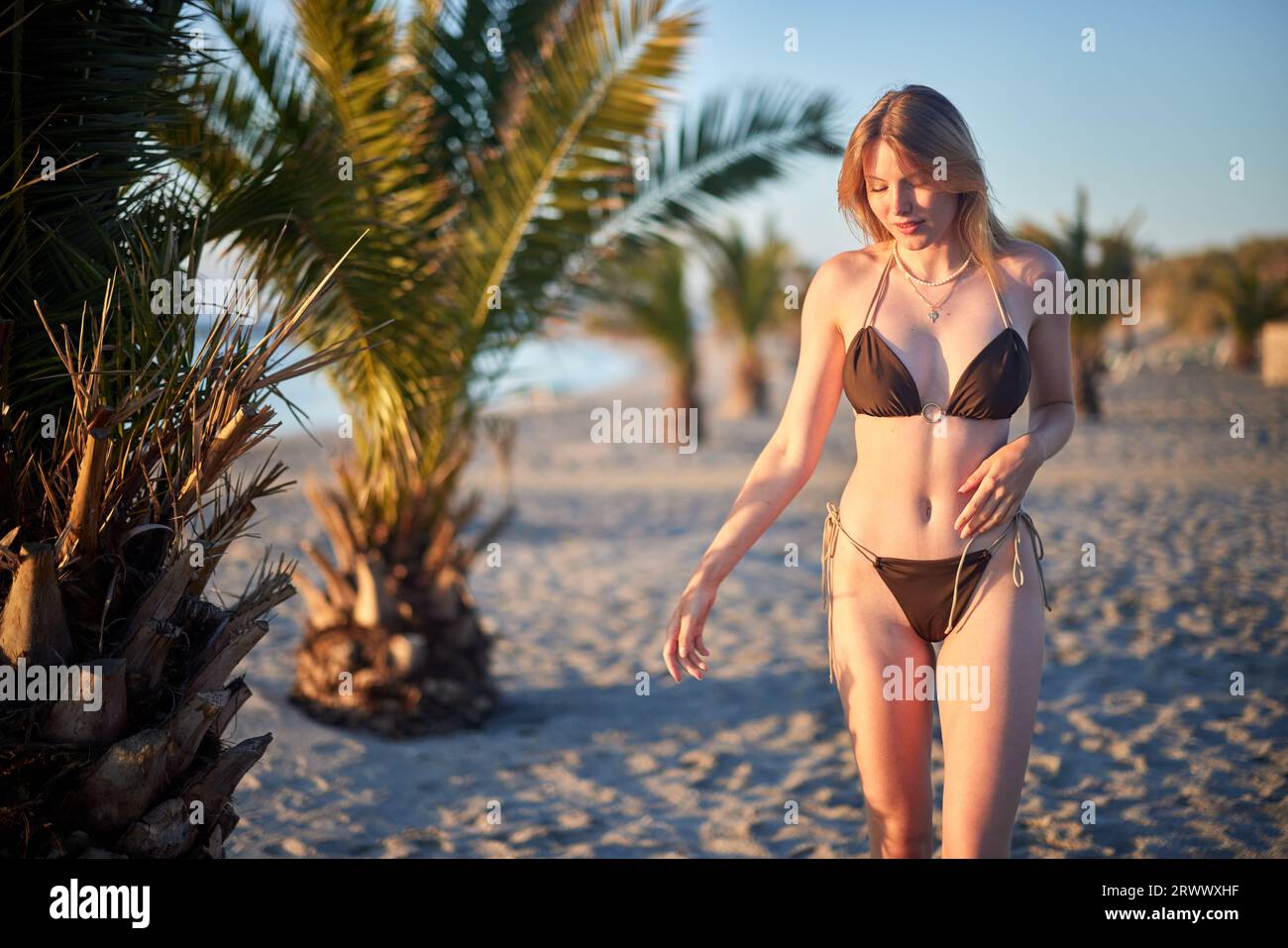 girl walking on the beach Stock Photo