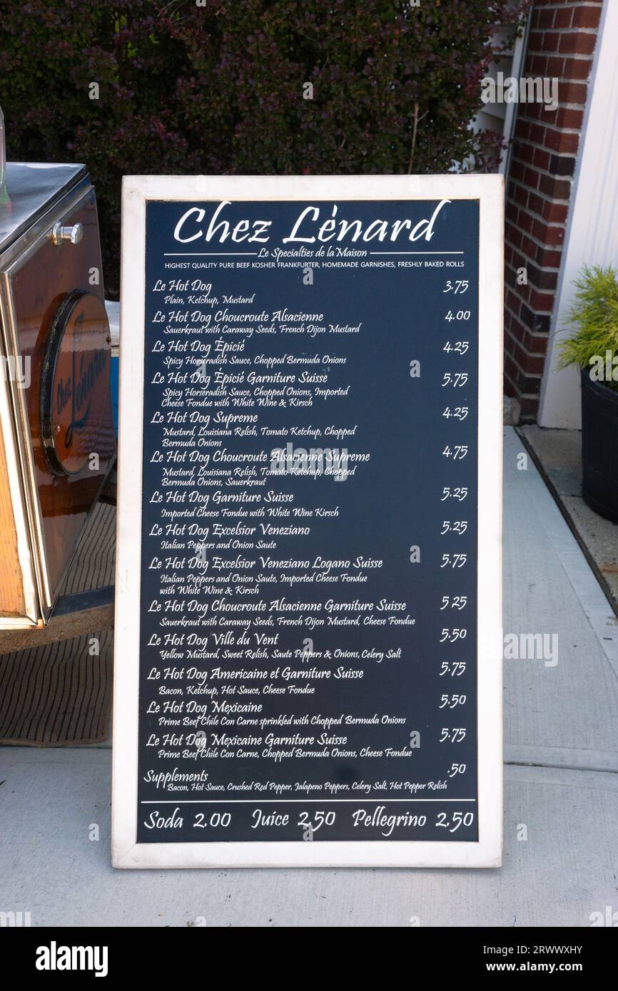 A large menu board for Chez Lenard showing 14 different varieties of hot dog for sale. On Main Street in Ridgefield, Connecticut. Stock Photo