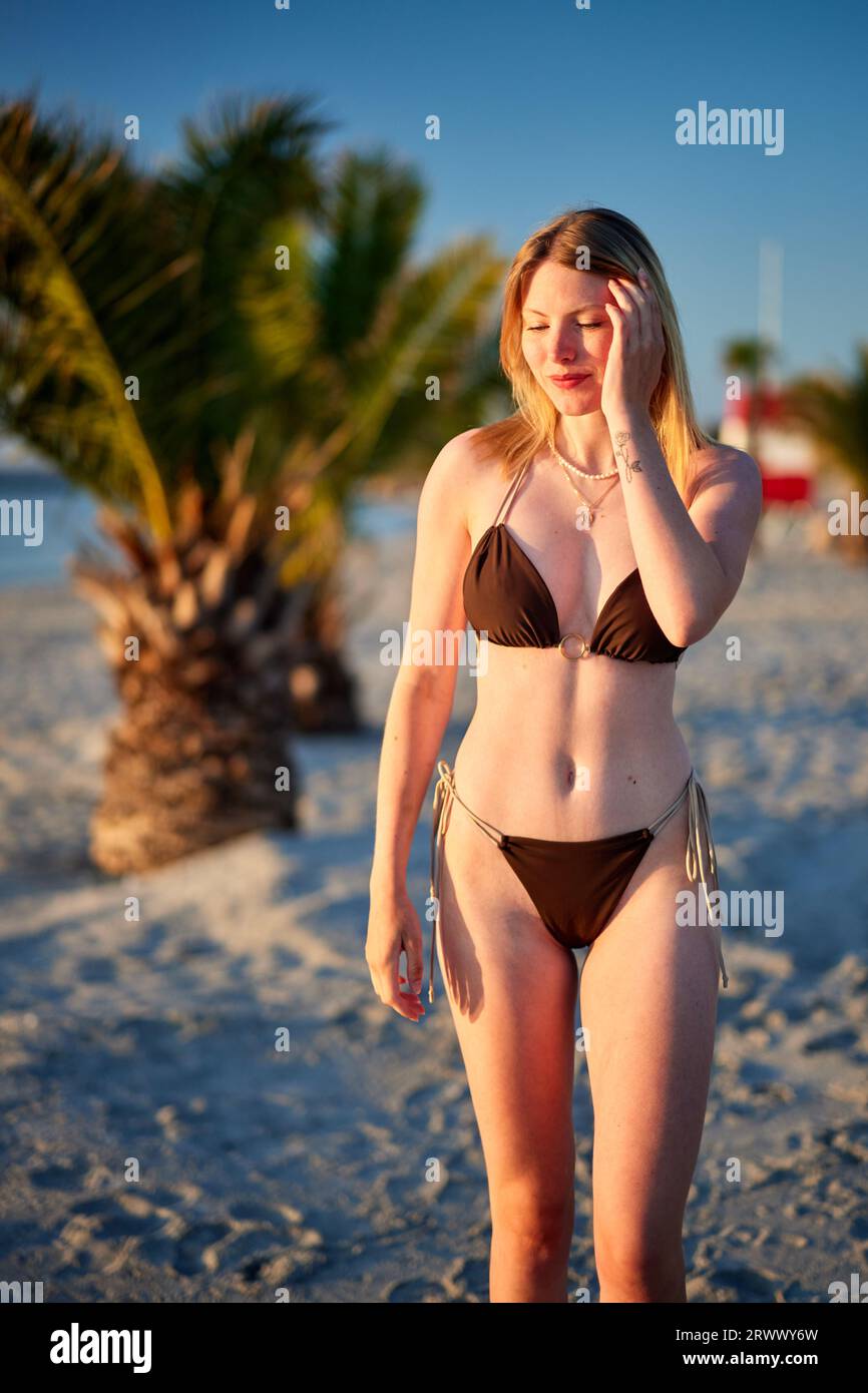 girl walking on the beach Stock Photo