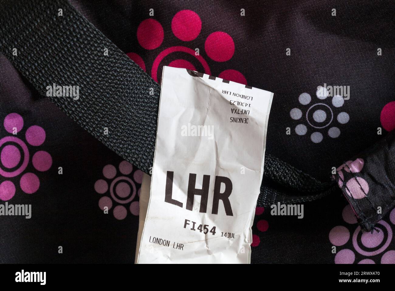 IcelandAir luggage label stuck on case for LHR London Heathrow airport in England UK Stock Photo