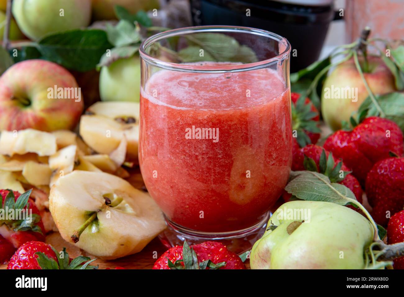 A glass of smoothie made with fresh fruits. Healthy living, lifestyle concept. Stock Photo