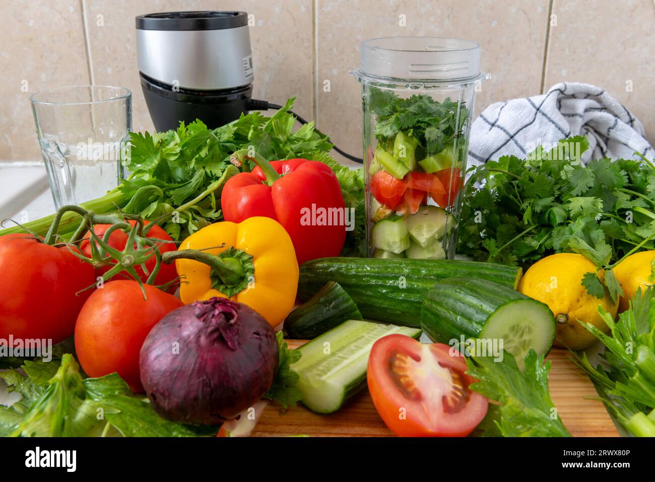Making vegetable smoothie with fresh vegetables in a blender. Health