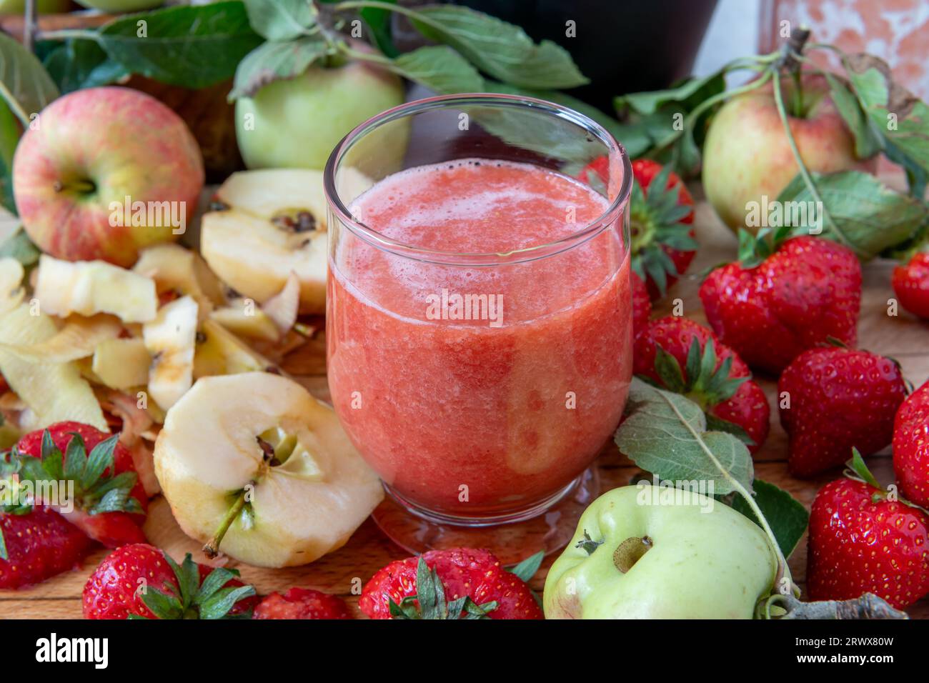 A glass of smoothie made with fresh fruits. Healthy living, lifestyle concept. Stock Photo