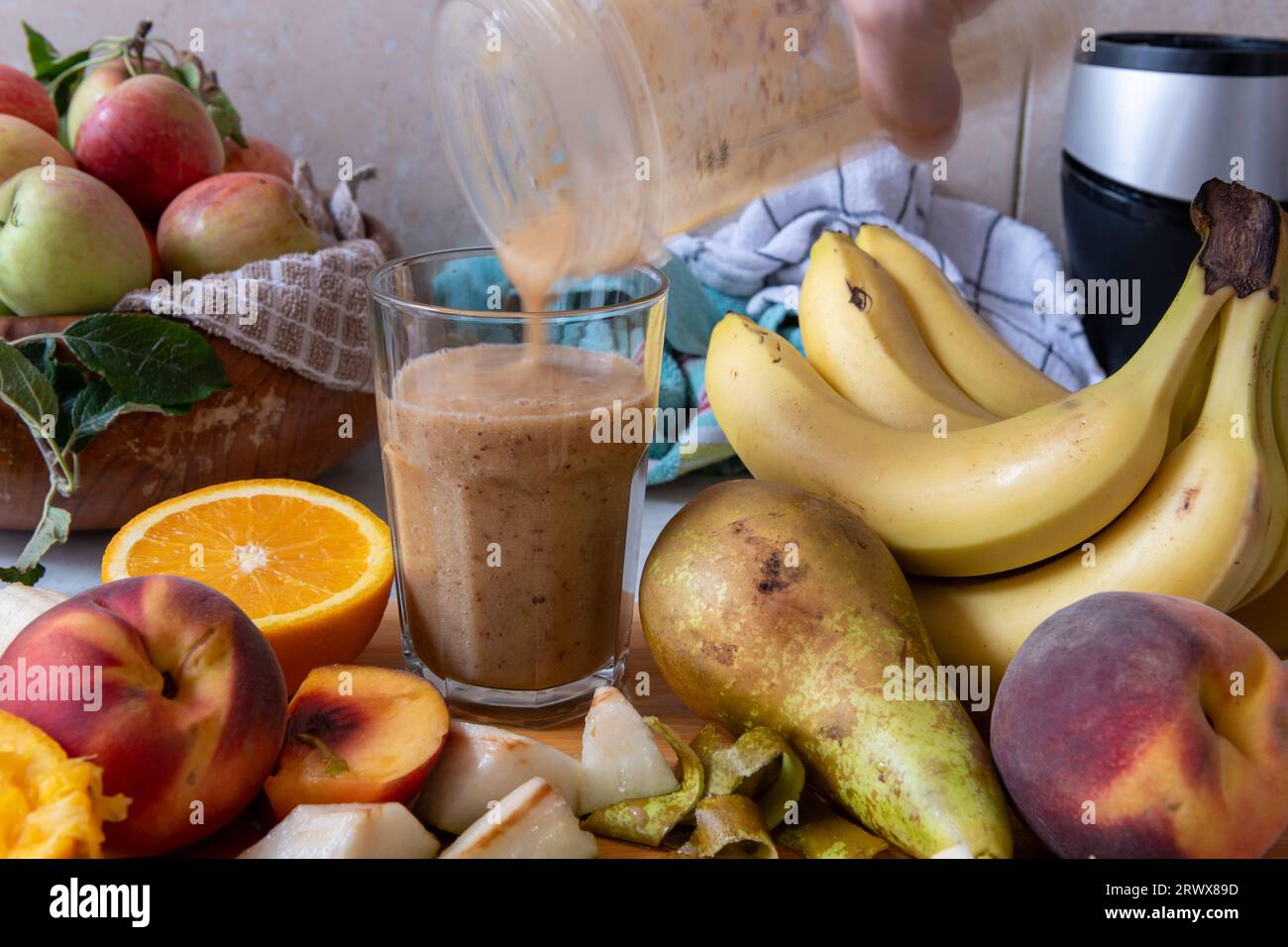 A glass of smoothie made with fresh fruits. Healthy living, lifestyle concept. Stock Photo