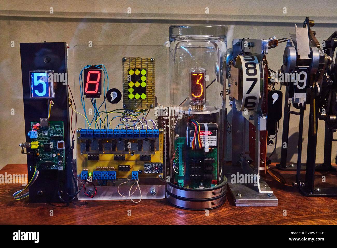 Complex mechanical timer with varying rotating numbers counting upward