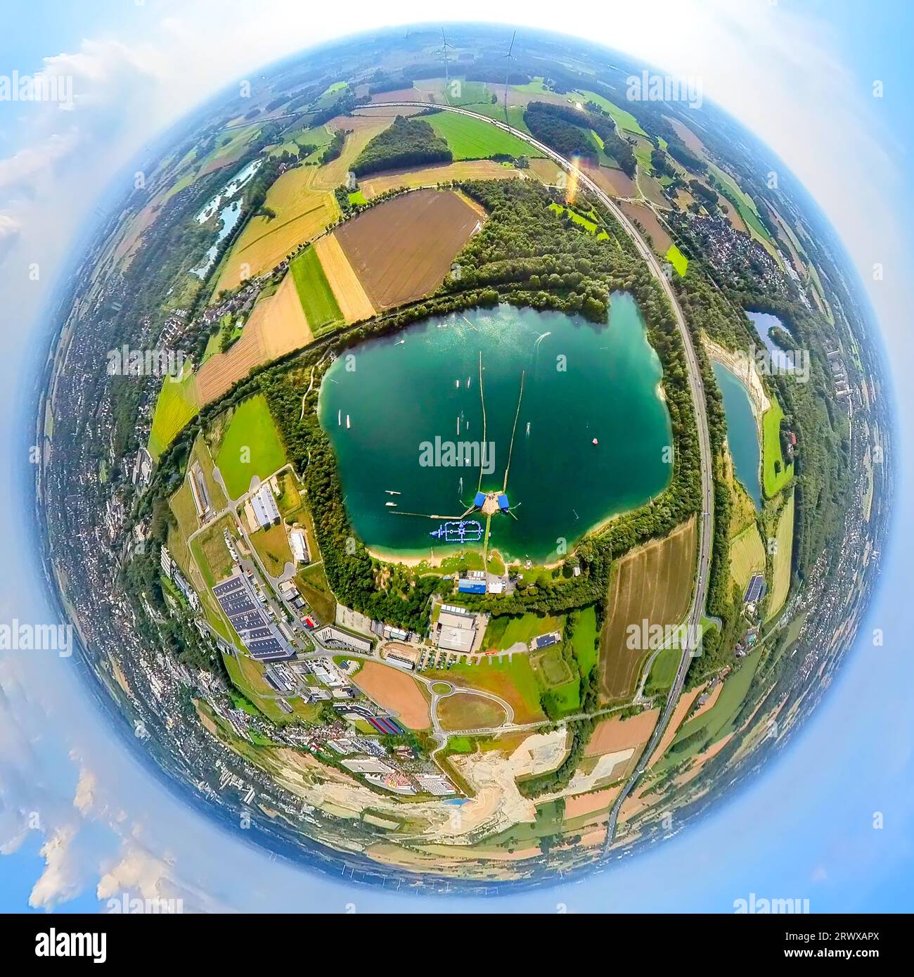 Aerial view, Tuttenbrocksee, TwinCable Beckum water ski facility in the lake, Obere Brede industrial park, globe, fisheye shot, 360 degree shot, tiny Stock Photo