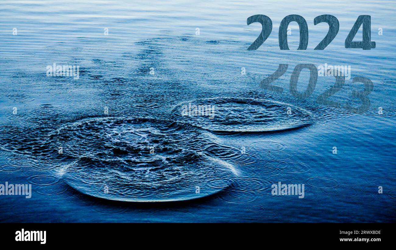 Transition from 2023 to new year concept with 2024 text on sea. Happy New Year 2024 is coming. High resolution photo image can be used as large banner Stock Photo
