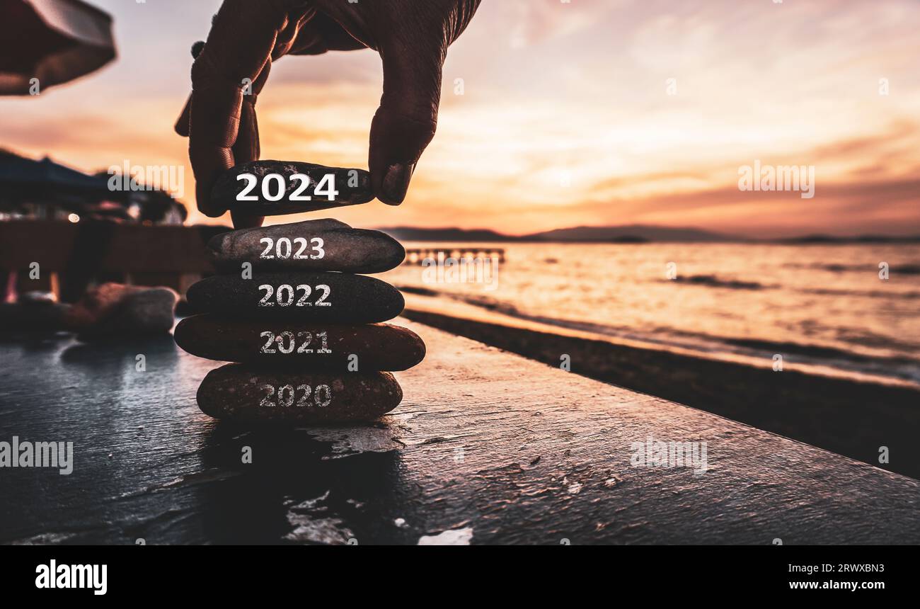 Happy new year 2024 replace old 2023. New Year 2024 is coming concept idea on orange sky. High resolution creative photo image. Stock Photo