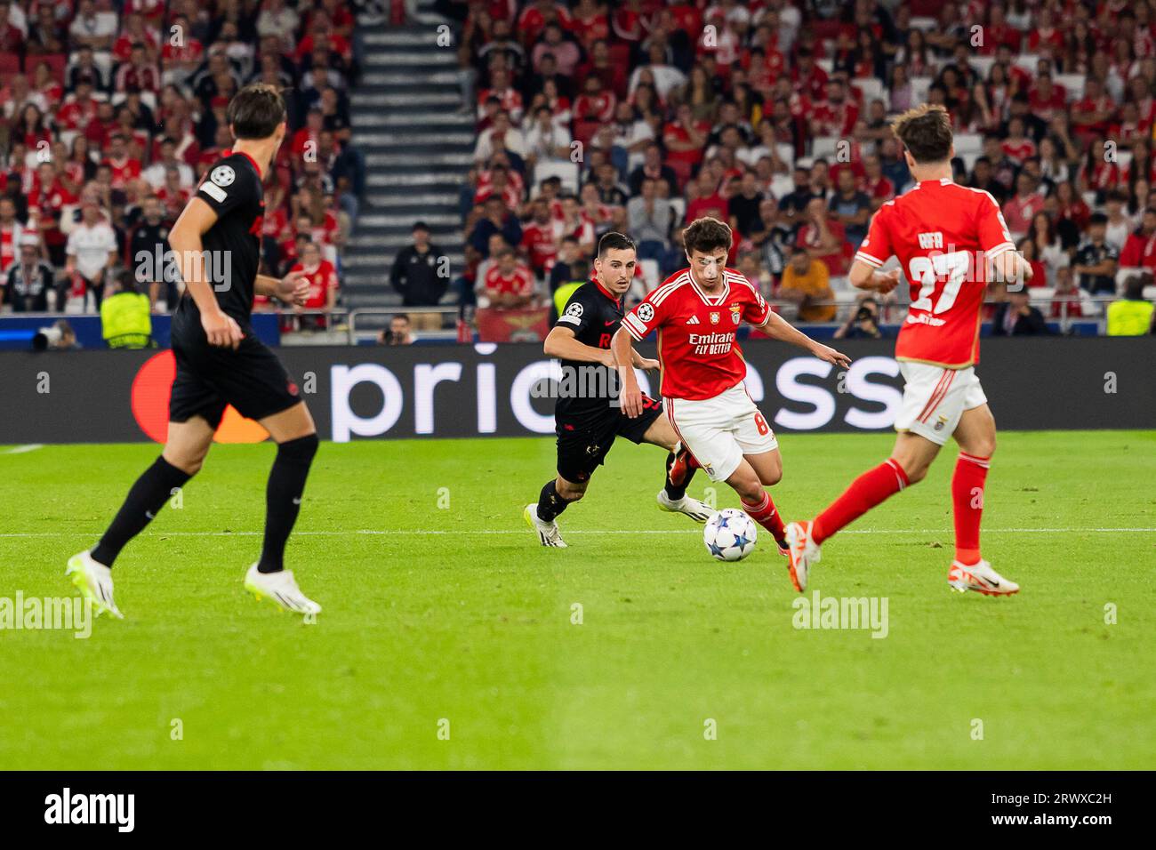 João Neves of SL Benfica seen in action during the champions league match between Benfica and FC Red Bull Salzburg at Estádio da Luz stadium. FC Salzburg won against SL Benfica by 0 - 2 Stock Photo