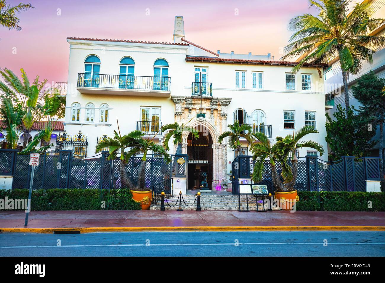 Miami Beach, USA, March 30 2022: Miami Beach South Beach Versace mansion street view at sunset. Famous ocean drive architecture view. Florida, USA Stock Photo