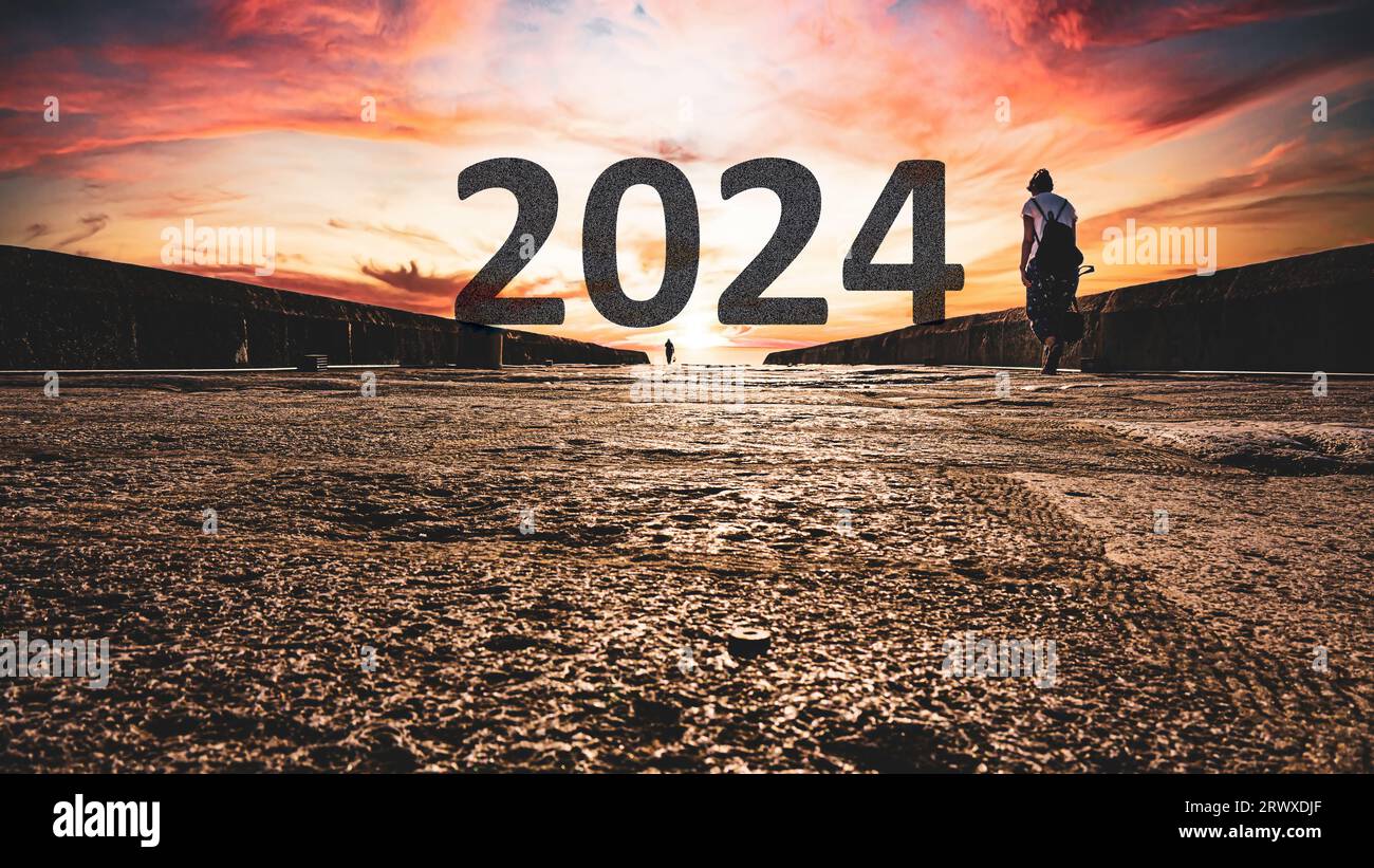 Happy New Year 2024 concept with the year 2024 text on distant. High resolution photo for large displays, print, banners. Stock Photo