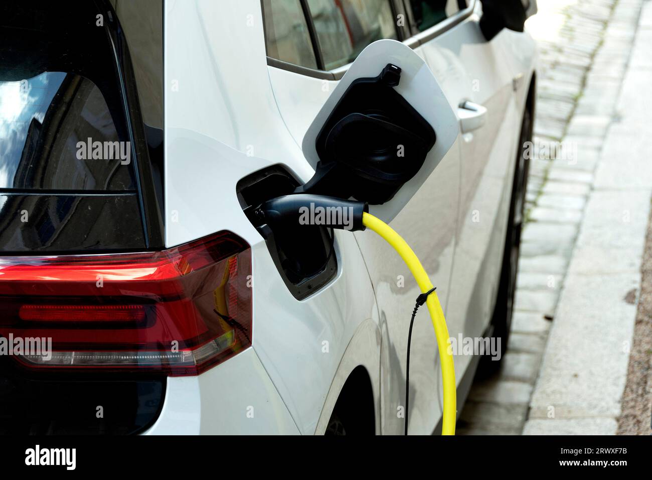 Electric car at public charging point. France Stock Photo