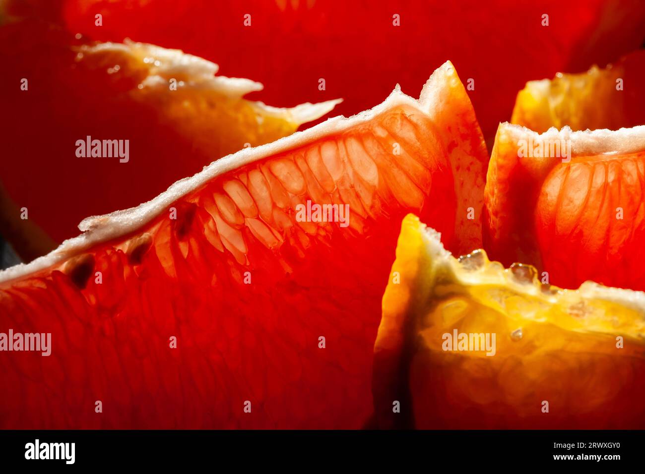 sliced grapefruit orange on wood background Stock Photo