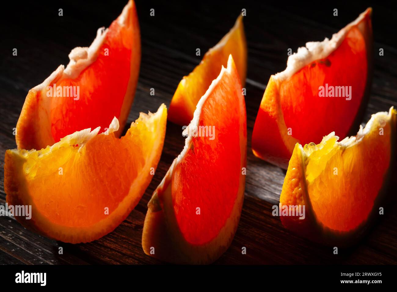 sliced grapefruit orange on wood background Stock Photo