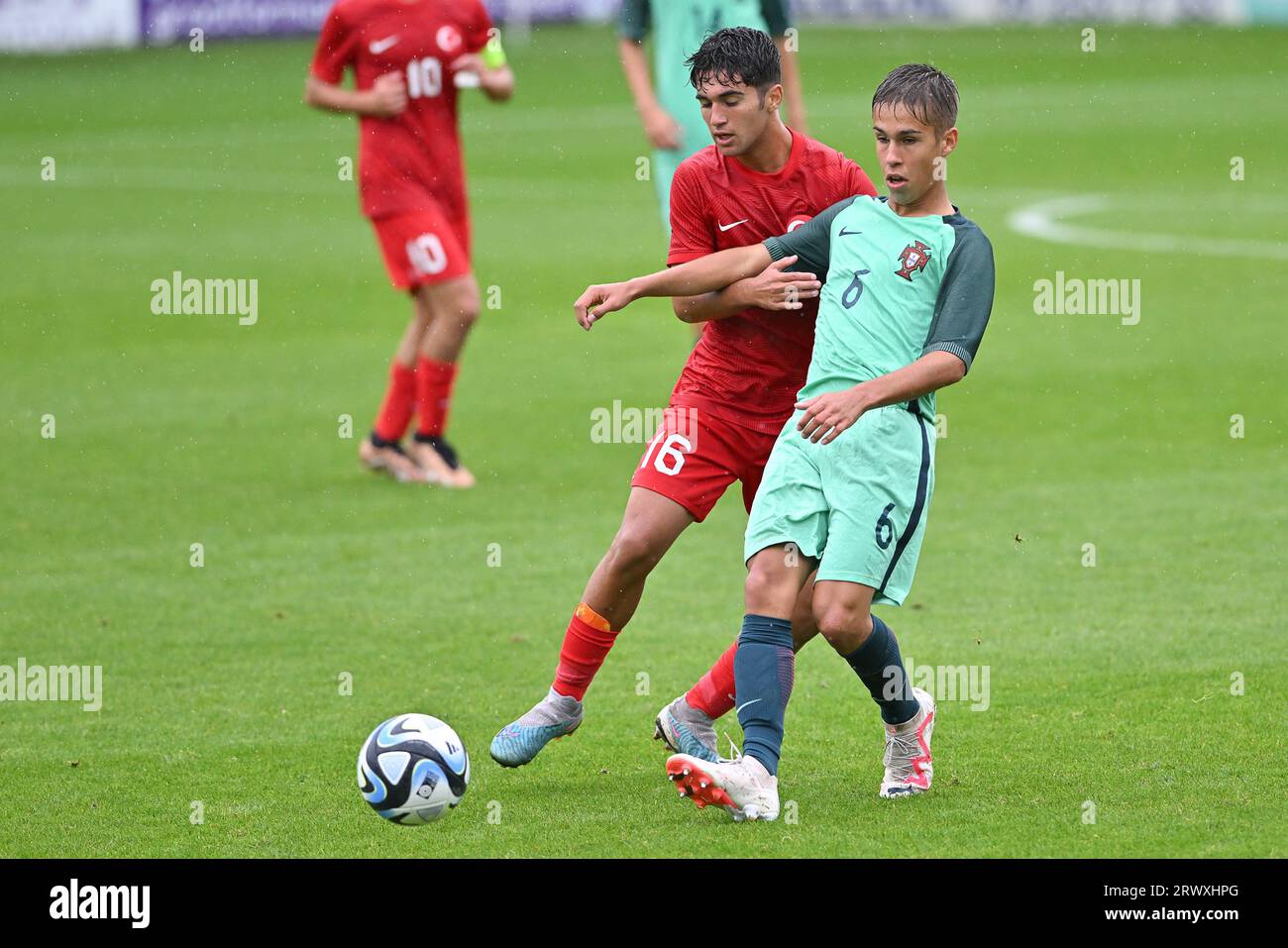 Oostakker, Belgium. 21st Sep, 2023. Rafael Quintas (6) of Portugal and Ahmet Hakan Atis (16) of Turkey pictured during a friendly soccer game between the national under 16 teams of Turkey and Portugal on Thursday 21 September 2023 in Oostakker, Belgium . Credit: sportpix/Alamy Live News Stock Photo