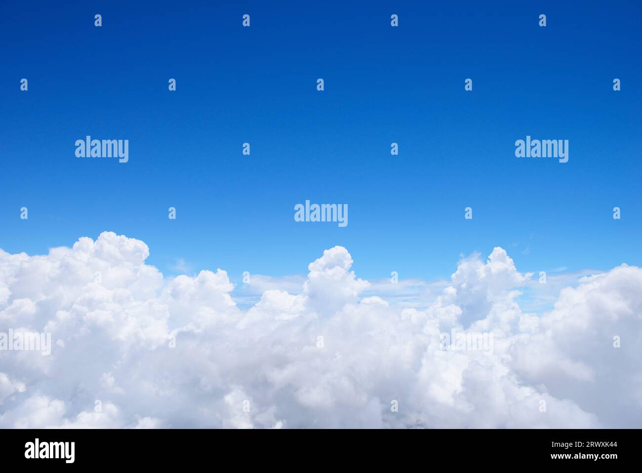 Gushing Iridescent Clouds and Blue Sky Stock Photo