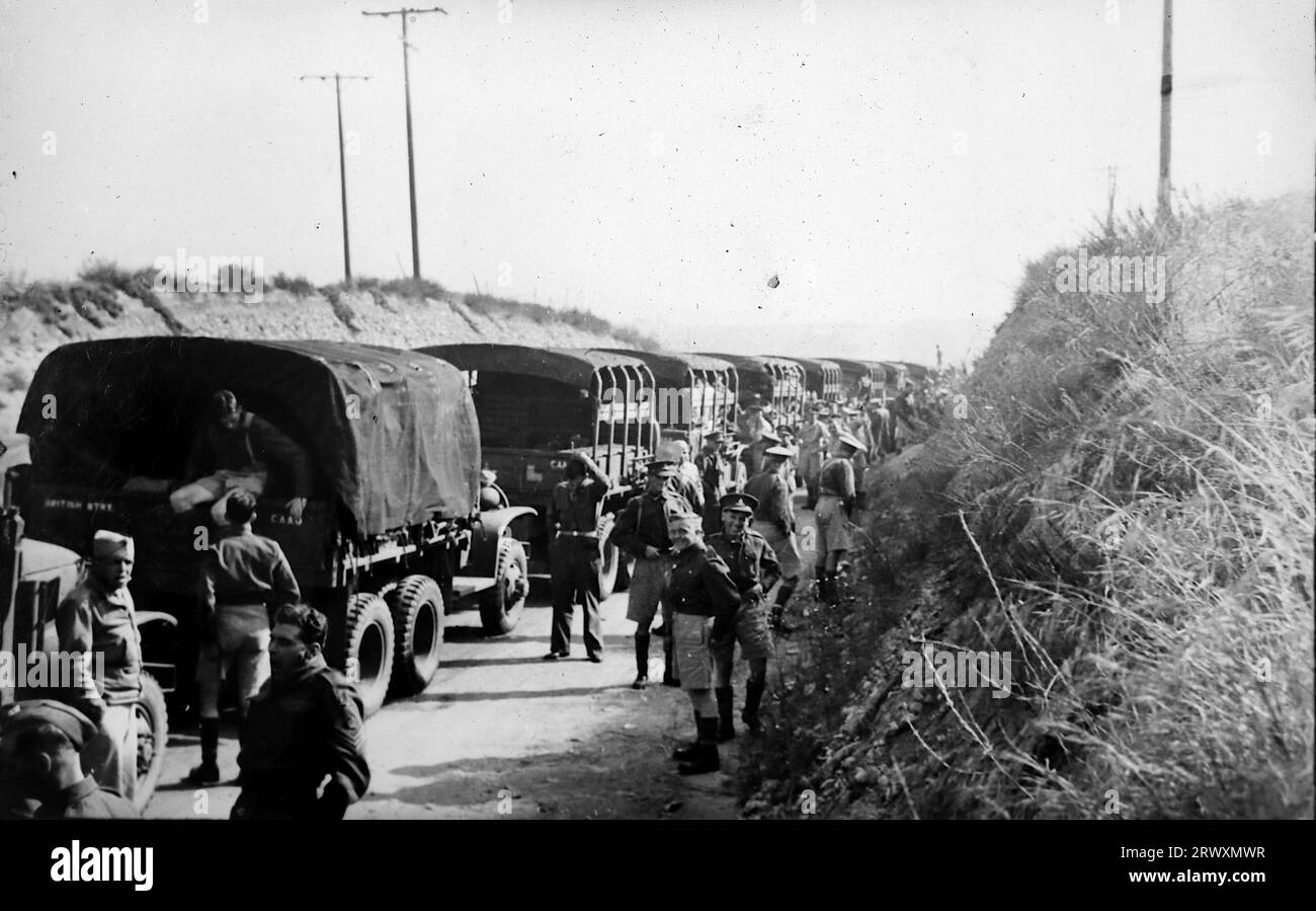 A halt on the road near Boston, army trucks. Rare photograph: From a collection compiled by an unknown British serviceman covering the No. 1 Composite Demonstration, AA Battery, tour of the USA, from July 11th 1943. This is one from over one hundred images in the collection which were on average around 4x3 inches. Stock Photo