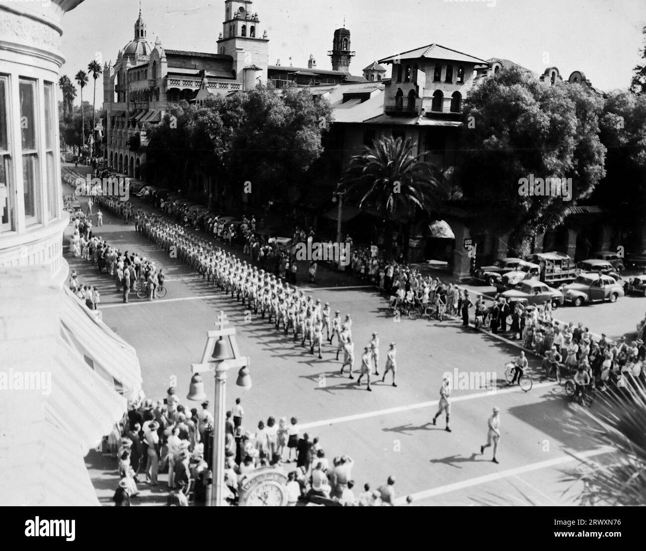 Parade at Riverside, California:  A birds-eye view of the parade. Rare photograph: From a collection compiled by an unknown British serviceman covering the No. 1 Composite Demonstration, AA Battery, tour of the USA, from July 11th 1943. This is one from over one hundred images in the collection which were on average around 4x3 inches. Stock Photo