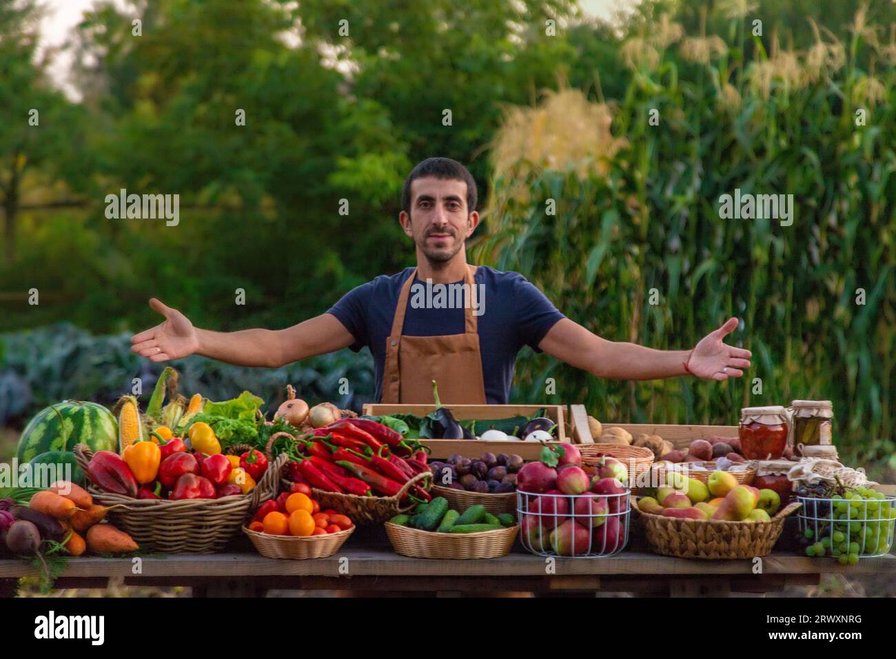 The farmer sells fruits and vegetables at the farmers market. Selective ...