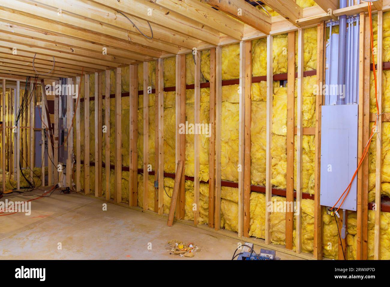 Installing mineral wool insulation in walls with fiber cotton thermal