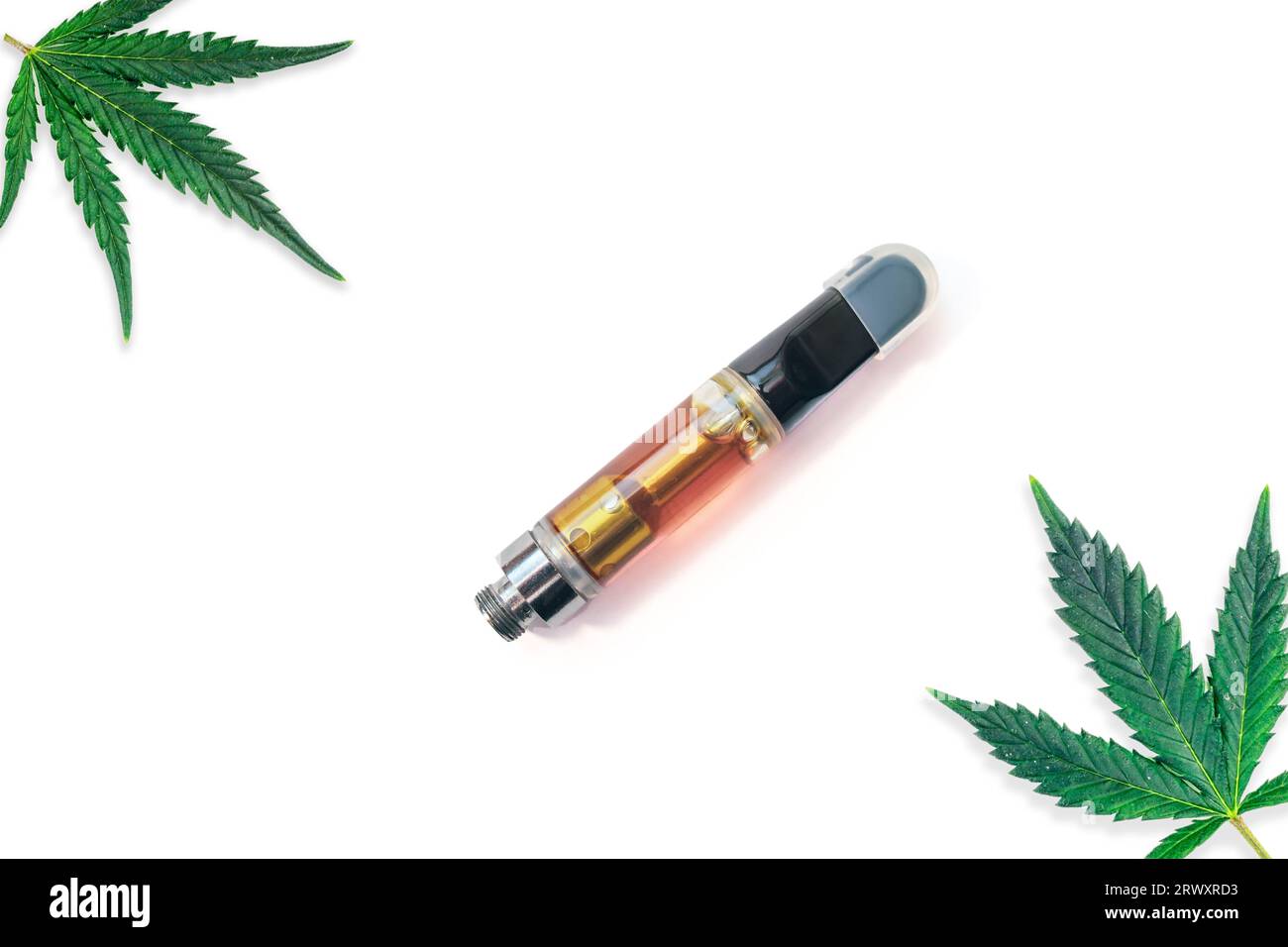 Vape cartridge with cannabis oil distillate with Marijuana leafs isolated on white Stock Photo