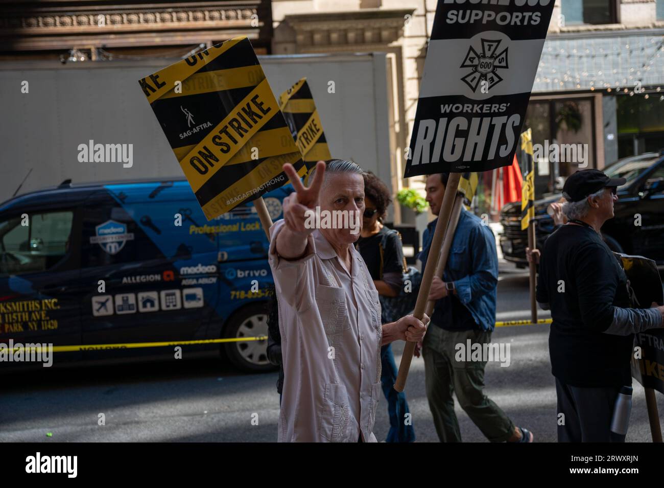 New York, USA. 21st Sep, 2023. Members of the SAG-AFTRA union, which represents actors and other performers, gather with supporters to picket outside of the offices of Warner Bros. Discovery and Netflix as part of an ongoing labor strike in New York, NY on September 21, 2023. The strike commenced on July 14, 2023 after union negotiations with film studios and streaming services, negotiating together as the Alliance of Motion Picture and Television Producers (AMPTP), broke down. (Photo by Matthew Rodier/Sipa USA) Credit: Sipa USA/Alamy Live News Stock Photo